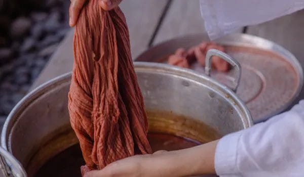 5. photo of a person using natural dyes for clothes